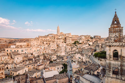 Wide view of the sassi di matera from the belvedere di san pietro barisano, blue sky with clouds