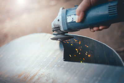 Close-up of man grinding metal 