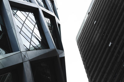 Low angle view of modern buildings against clear sky