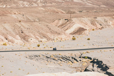 Scenic view of desert against mountain range