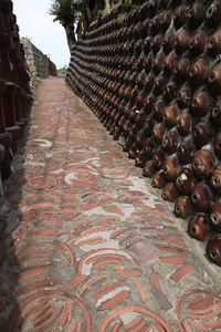 Close-up of fresh fruit on footpath against building