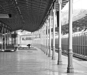 Man walking in corridor of building