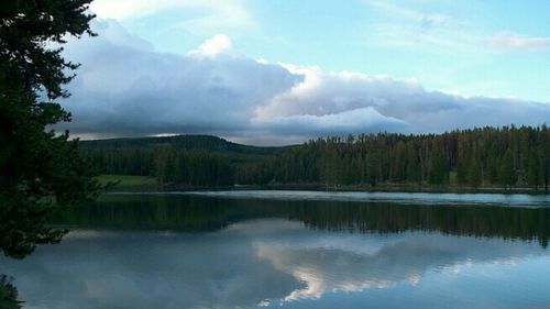 Scenic view of lake against cloudy sky