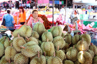 Durian fruits for sale at market stall