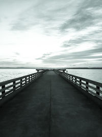 Pier over sea against sky