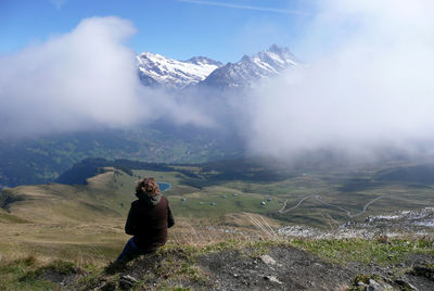 Man on mountain against sky