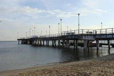 Pier over sea against sky