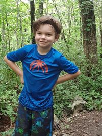 Portrait of boy in forest