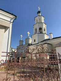 Low angle view of building against clear blue sky