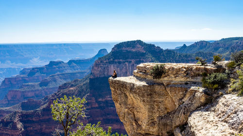 Scenic view of mountains against blue sky