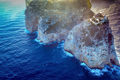 High angle view of rock formation in sea