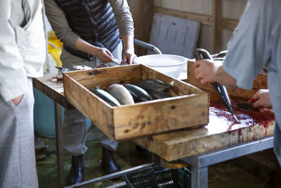 Midsection of man preparing food