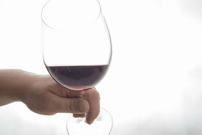 Close-up of woman holding wineglass