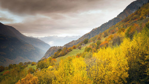 Scenic view of landscape and mountains against sky