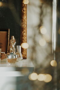 Close-up of glass bottle on table at home