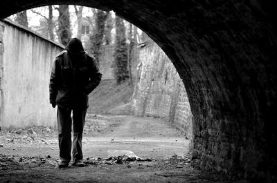 Man standing in tunnel