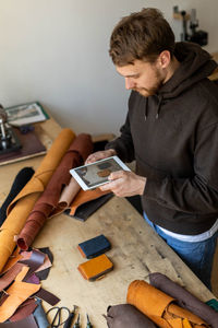 Young man using laptop on table