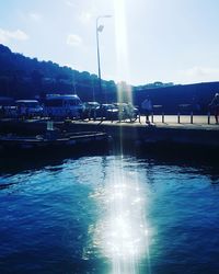 Reflection of clouds in water on sunny day