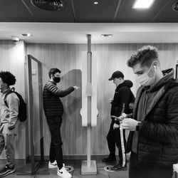 People standing in illuminated room