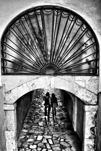 Woman walking in tunnel