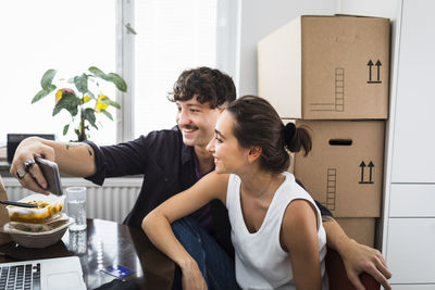 Couple taking selfie at home