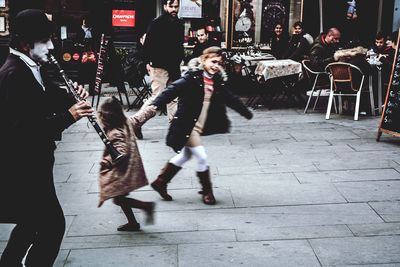 People on street in city at night