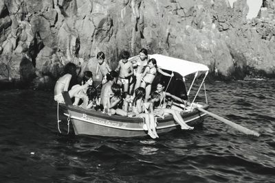 People on boat sailing in sea