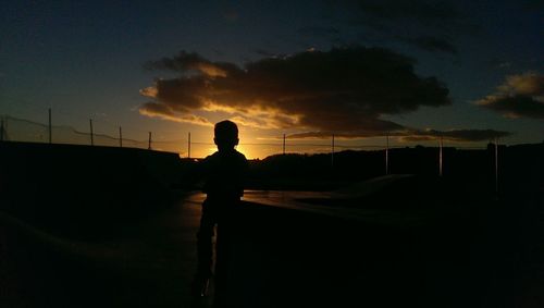 Silhouette of man at sunset