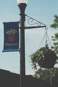 Low angle view of street light against sky