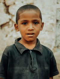 Portrait of young man standing outdoors