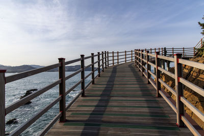 Pier over sea against sky