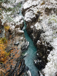 High angle view of water flowing through rocks