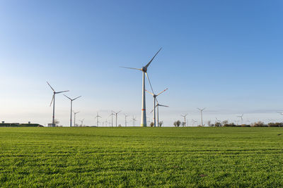 Wind turbines for the production of electricity from wind in a field in western germany.