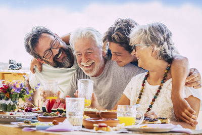 Cheerful family enjoying lunch in patio