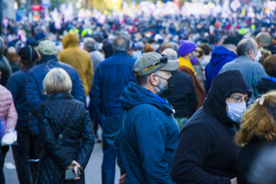 Rear view of people looking at city