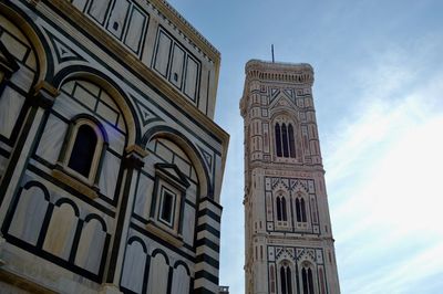 Low angle view of ornate building against sky