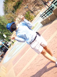 Rear view of man skateboarding