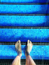 Low section of a man in a swimming pool