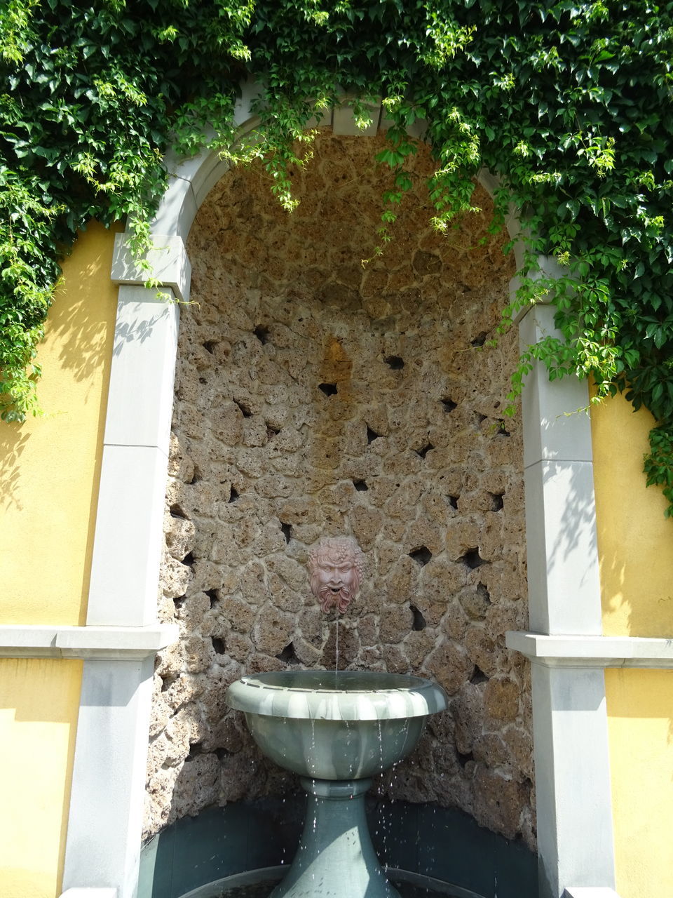 FOUNTAIN AGAINST BUILDING