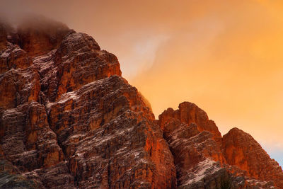 Low angle view of rock formation against sky