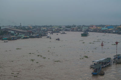 High angle view of boats in sea against clear sky