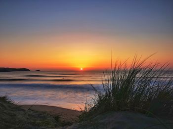 Scenic view of sea against sky during sunset