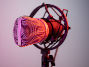 Close-up of microphone against white background