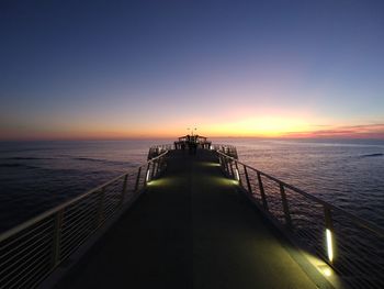 Scenic view of sea against clear sky during sunset