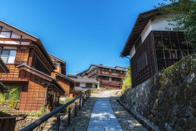 Low angle view of building against clear blue sky