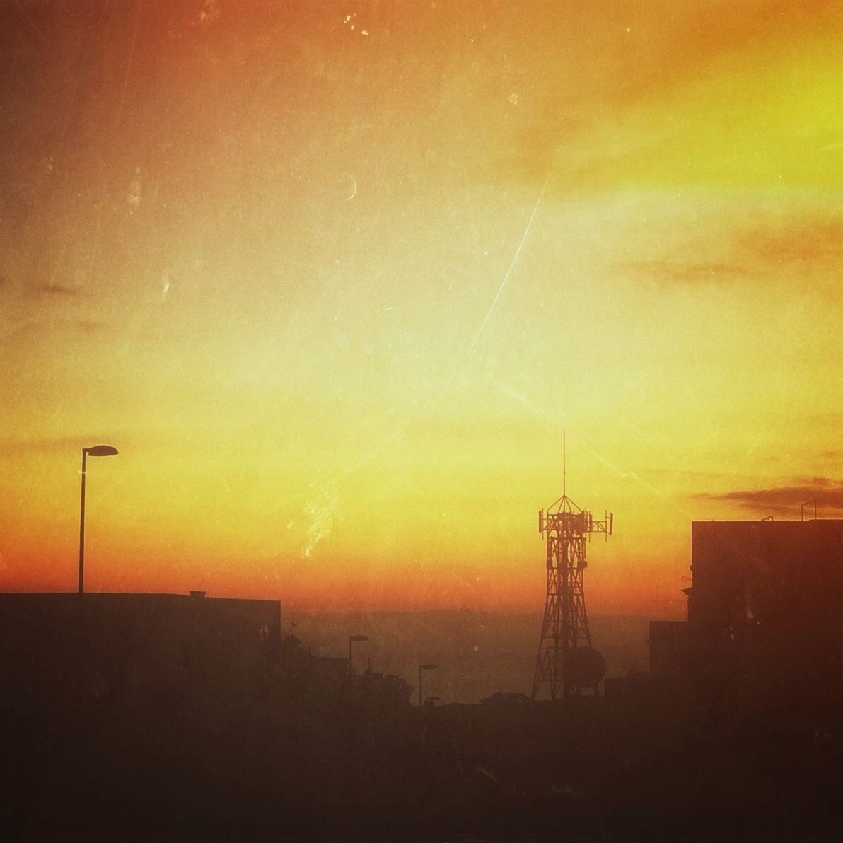 sunset, orange color, silhouette, sky, built structure, scenics, building exterior, architecture, beauty in nature, power line, tranquil scene, nature, tranquility, outdoors, no people, electricity, fuel and power generation, electricity pylon, idyllic, cloud - sky