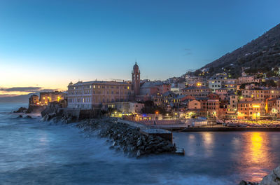 Illuminated buildings at waterfront