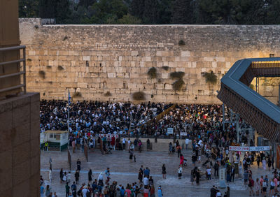 High angle view of group of people in front of building