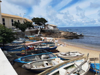 Boats moored at harbor