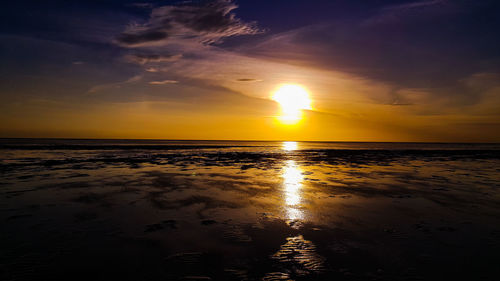 Scenic view of sea against dramatic sky